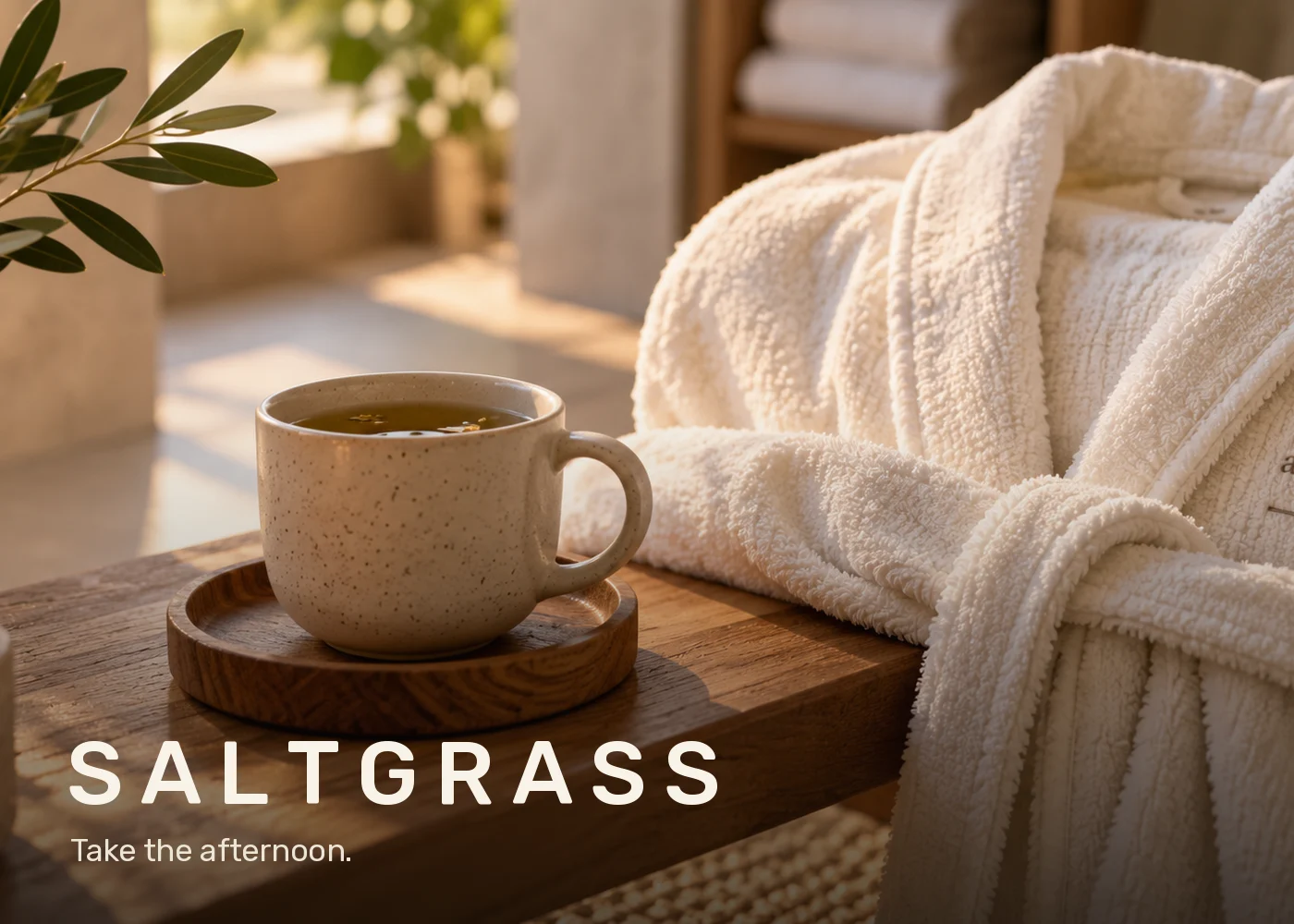 Saltgrass: a cup of tea beside a spa robe in afternoon light